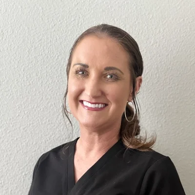 Jayme Pyle smiling in a black shirt.