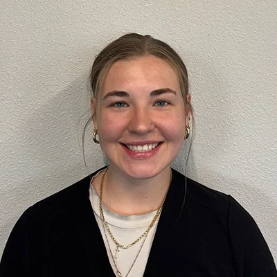 Alyssa smiling in a black shirt.