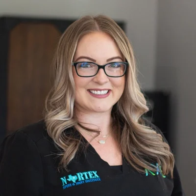 Deborah smiling in a black shirt.