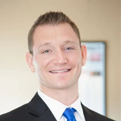 Dr. Daniel Wojnicki smiling in a suit.