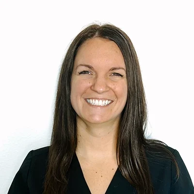 Taylor smiling in a black shirt.