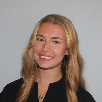 Callie Schattle smiling in a black shirt.