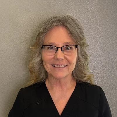 Doris Gonzalez smiling in a black shirt.